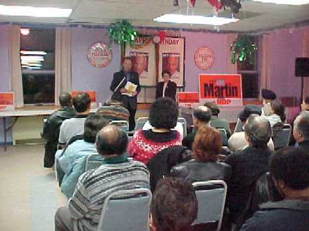 Pat speaks to an audience in Winnipeg, November 2003