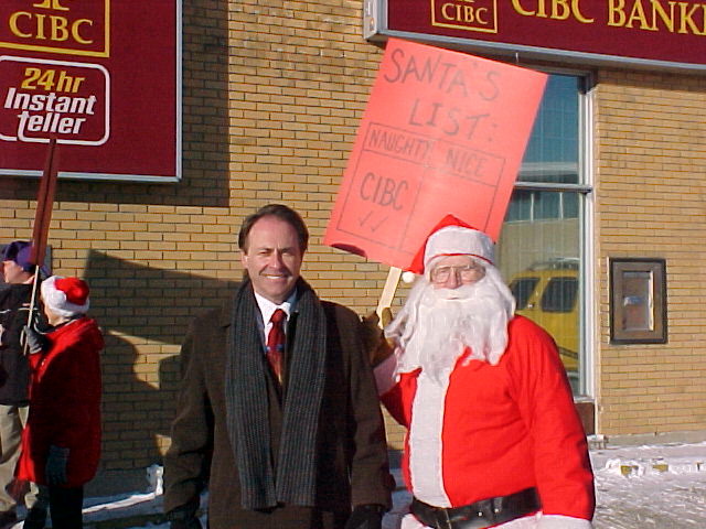 Pat and his constituents stand outside of CIBC in Winnipeg to protest against bank closures.